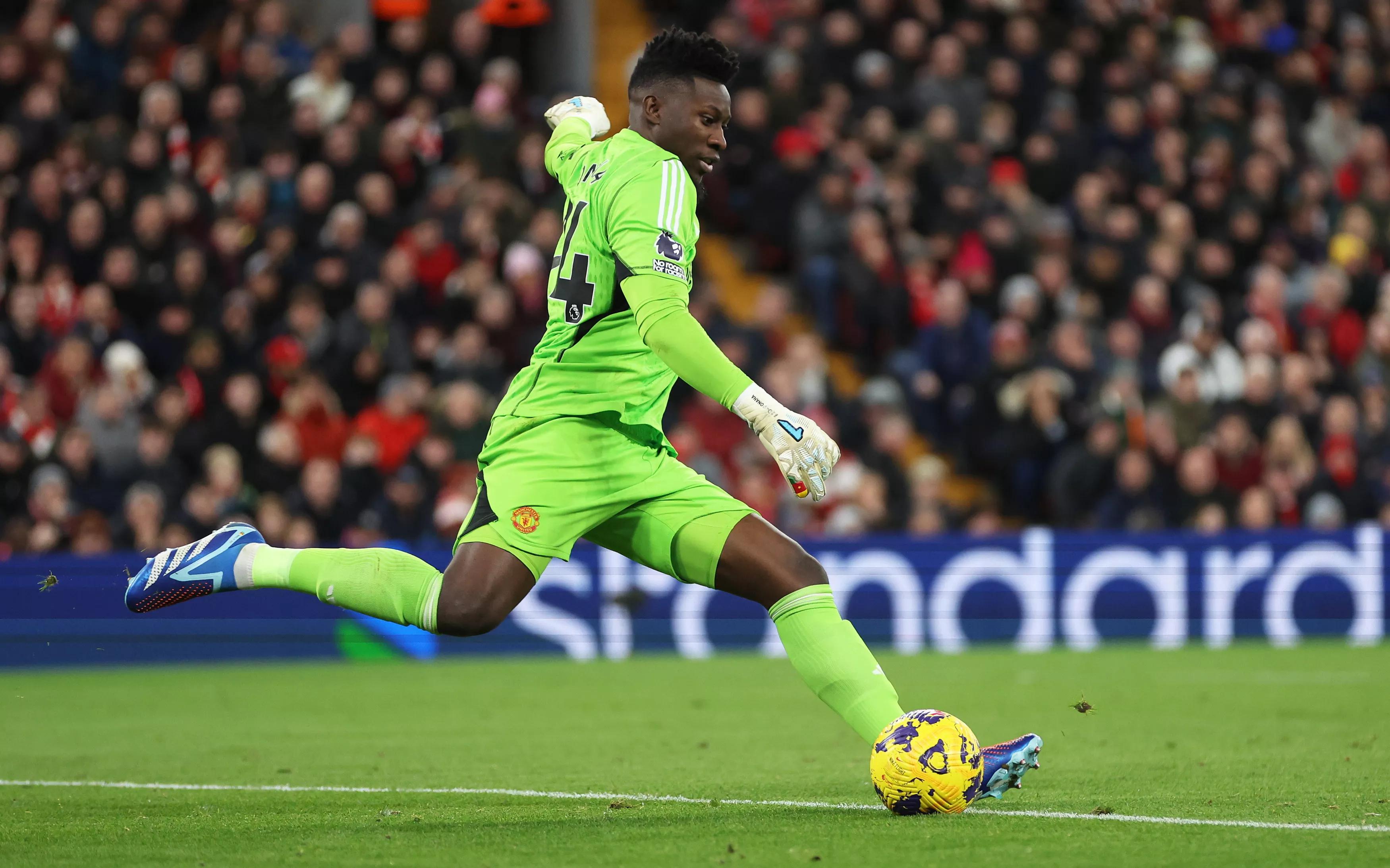 LIVERPOOL, ENGLAND - DECEMBER 17: Andre Onana of Manchester United in action during the Premier League match between Liverpool FC and Manchester United at Anfield on December 17, 2023 in Liverpool, England. (Photo by Clive Brunskill/Getty Images)